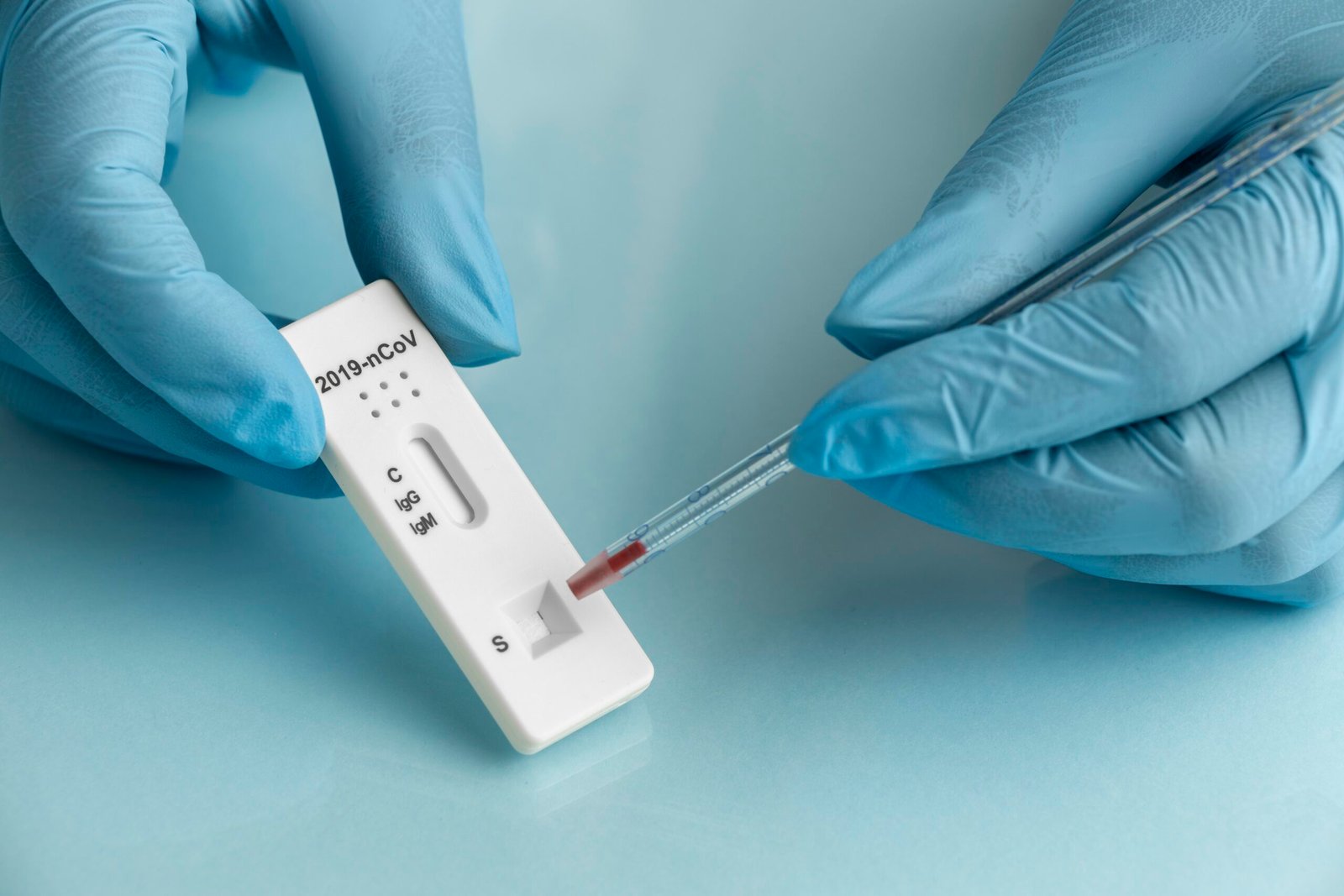 How To Use hand with protective gloves making covid test