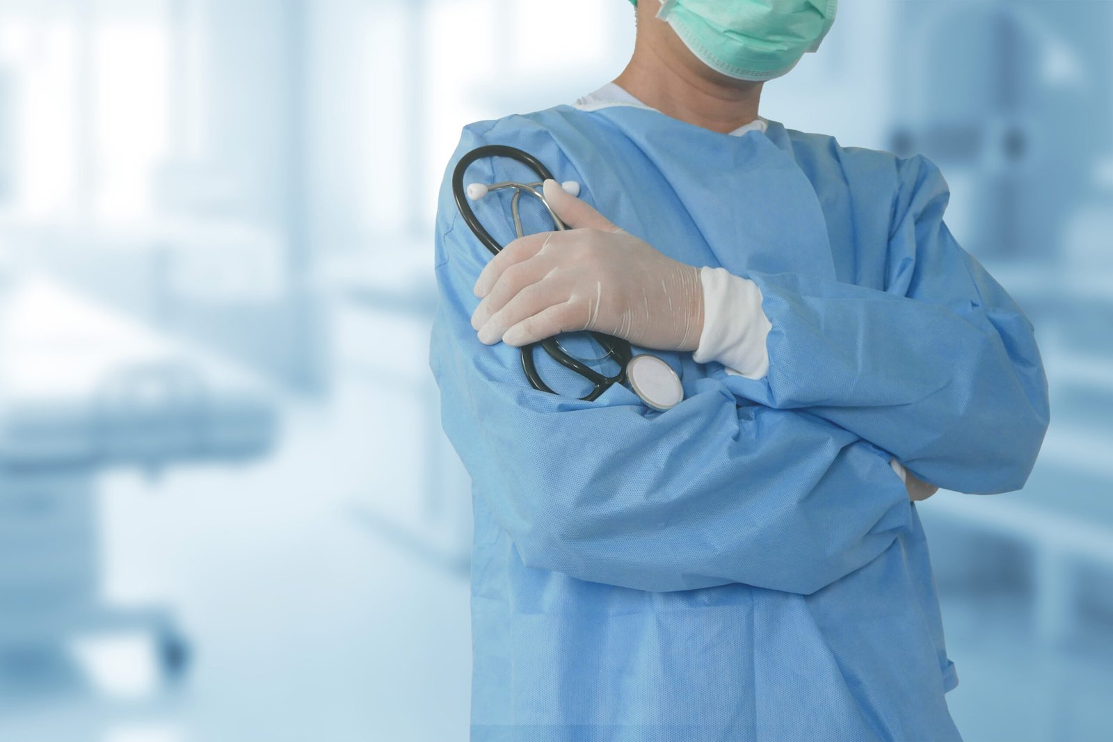 medical team performing operation. group of surgeon at work in operating theatre toned in blue. doctor operation in operation room at hospital concept for insurance advertising.